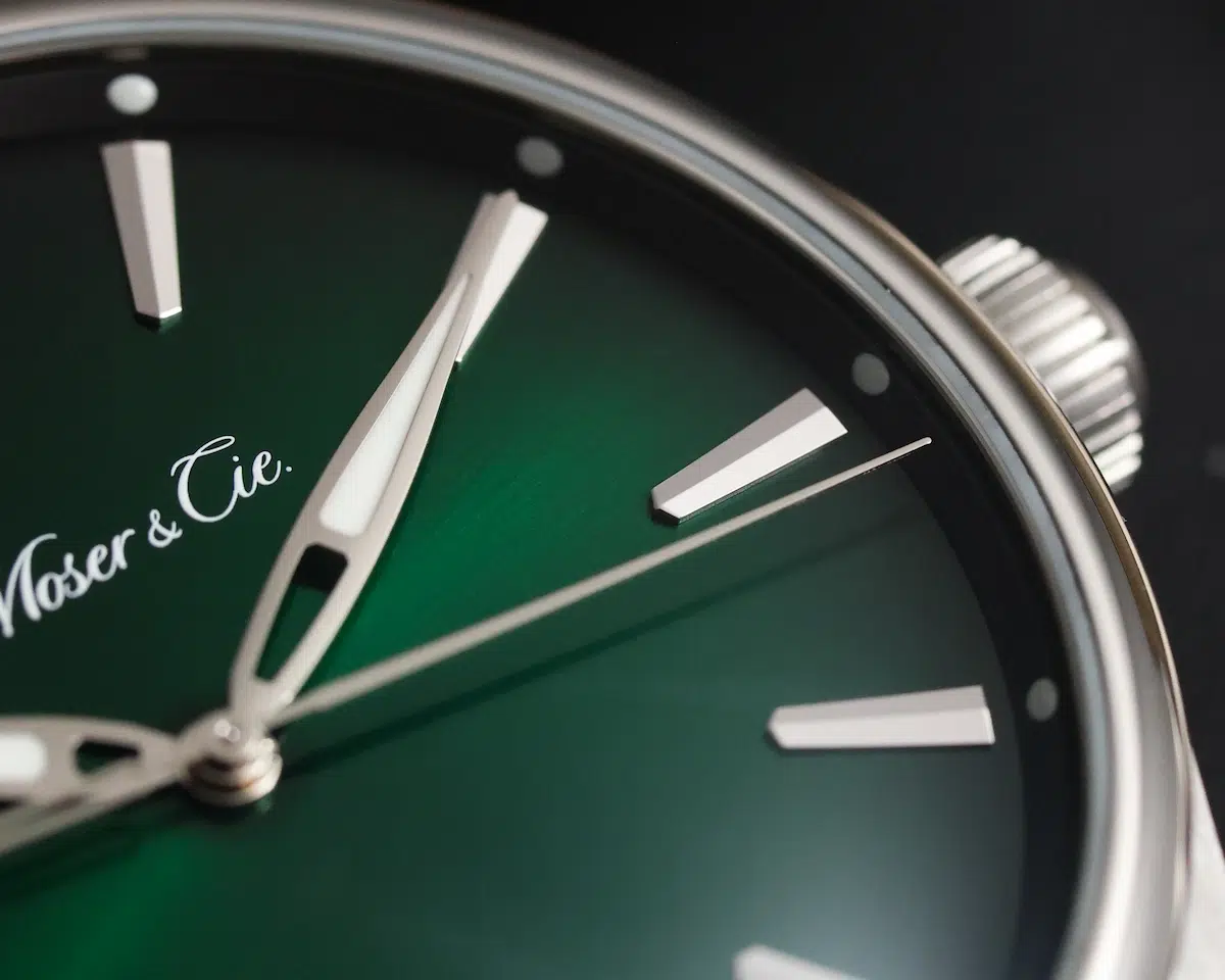 Macro shot of H. Moser & Cie. Pioneer Centre Seconds Cosmic Green dial and leaf-style hands