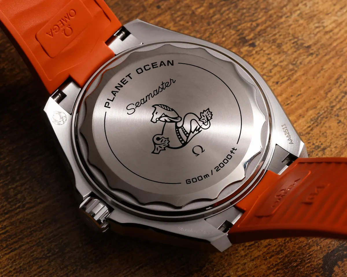 Omega Planet Ocean 600M titanium caseback with seahorse emblem on orange strap version