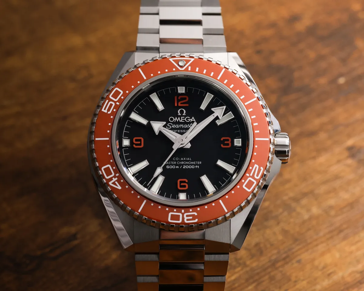 Omega Planet Ocean 600M fourth-generation dive watch in orange bezel on stainless steel bracelet