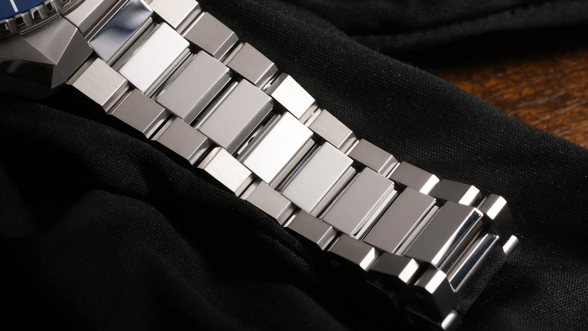 Omega Planet Ocean 600M stainless steel bracelet close-up showing updated link design