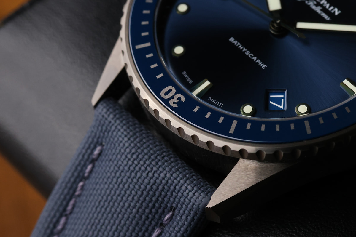 Blancpain Bathyscaphe 43MM bezel, indices, and sailcloth strap close-up