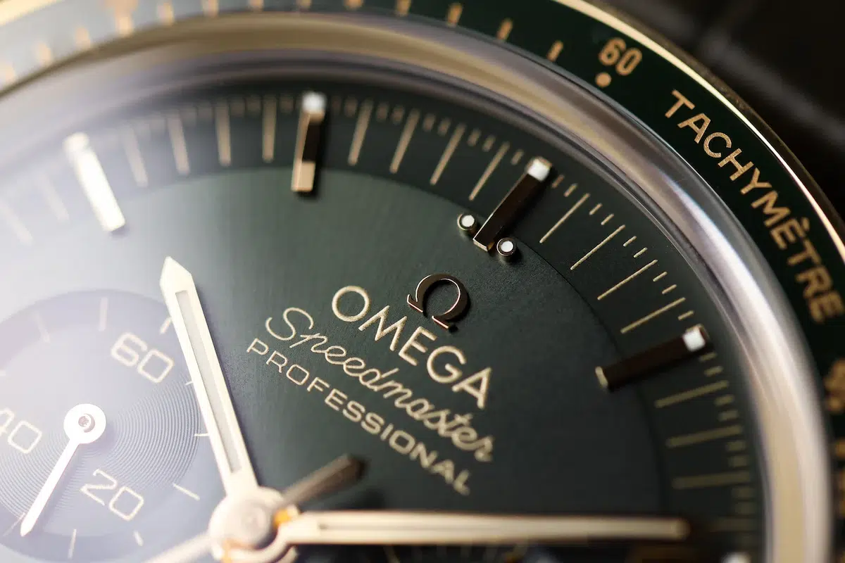 Close-up of Omega Speedmaster Moonwatch Professional green dial and Moonshine gold tachymeter bezel