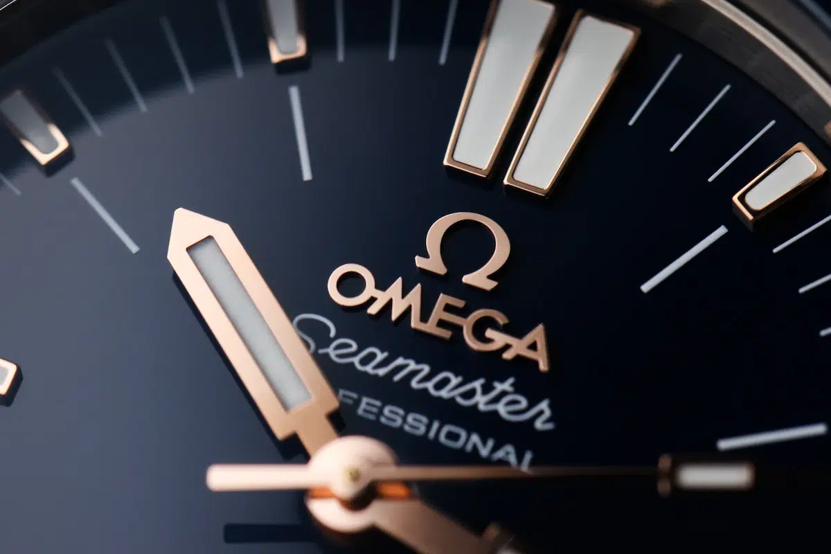 Macro view of Omega Seamaster Ploprof blue dial and rose gold hour markers
