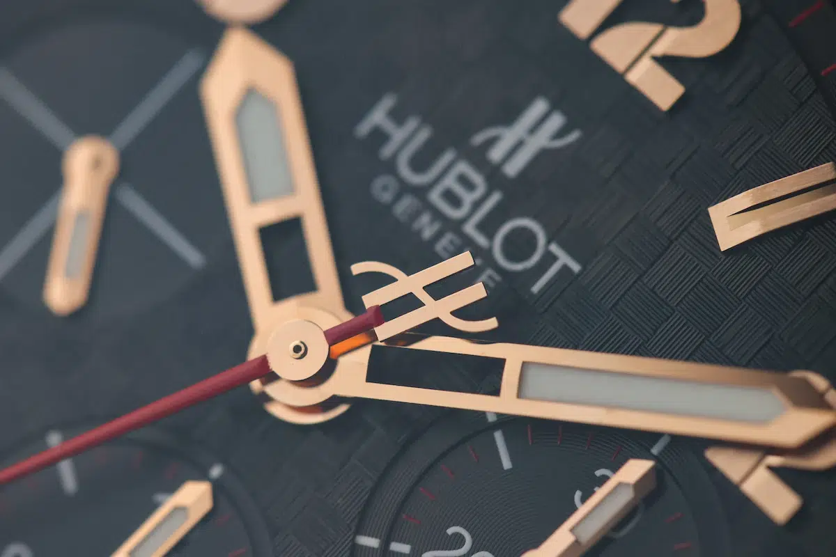 Macro view of the Hublot Big Bang dial focusing on the rose gold hands and Hublot logo