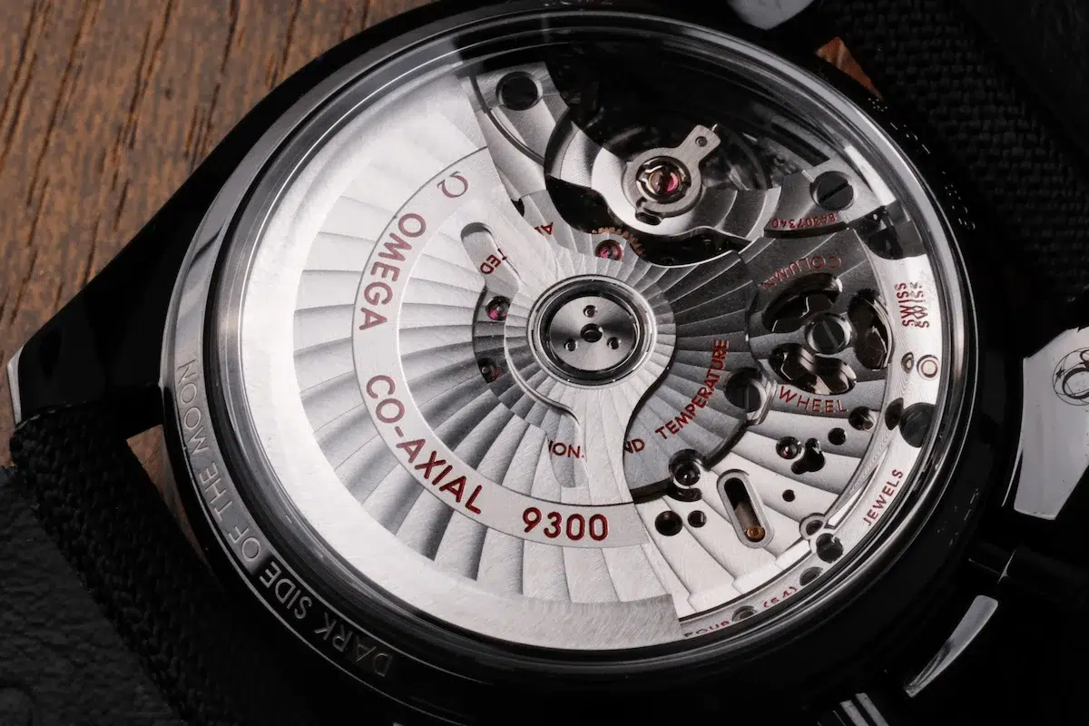 Omega Caliber 9300 movement visible through sapphire caseback of Speedmaster Dark Side of the Moon
