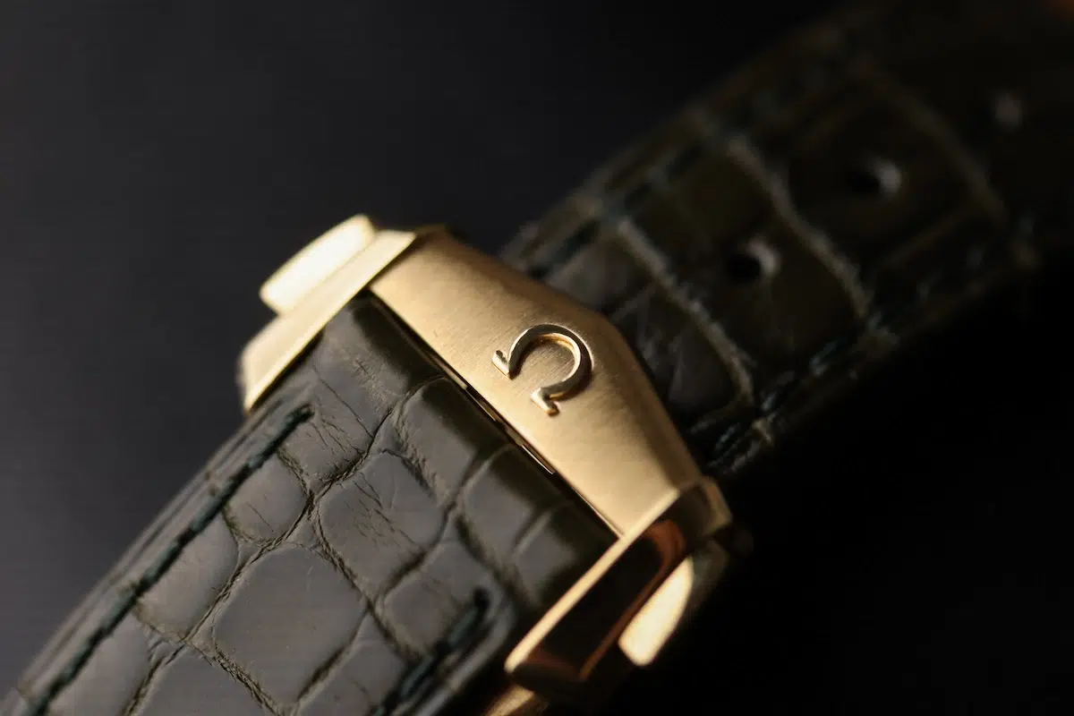 Omega Moonwatch green alligator strap with Moonshine gold pin buckle