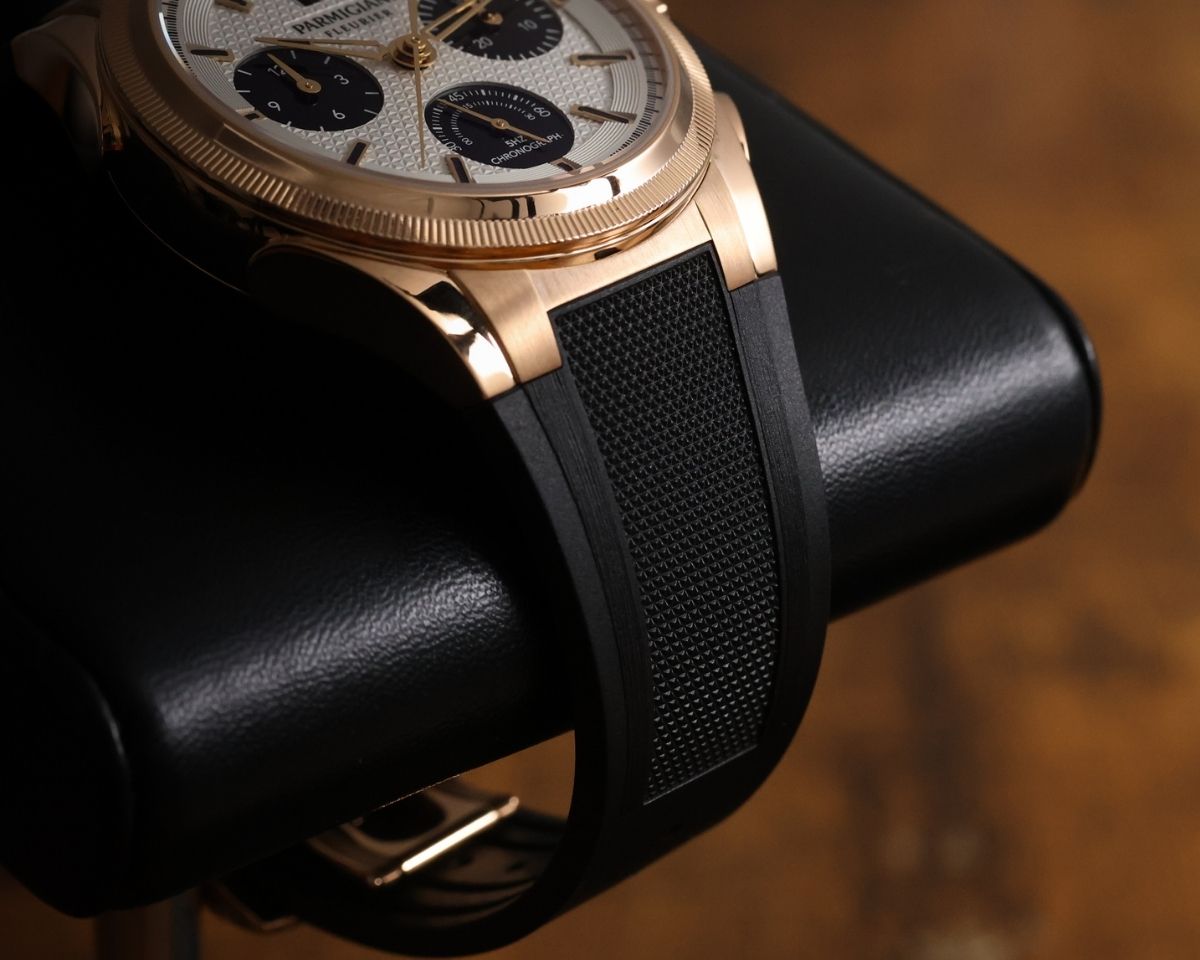 Parmigiani Tondagraph GT Rose Gold on rubber strap resting on display stand