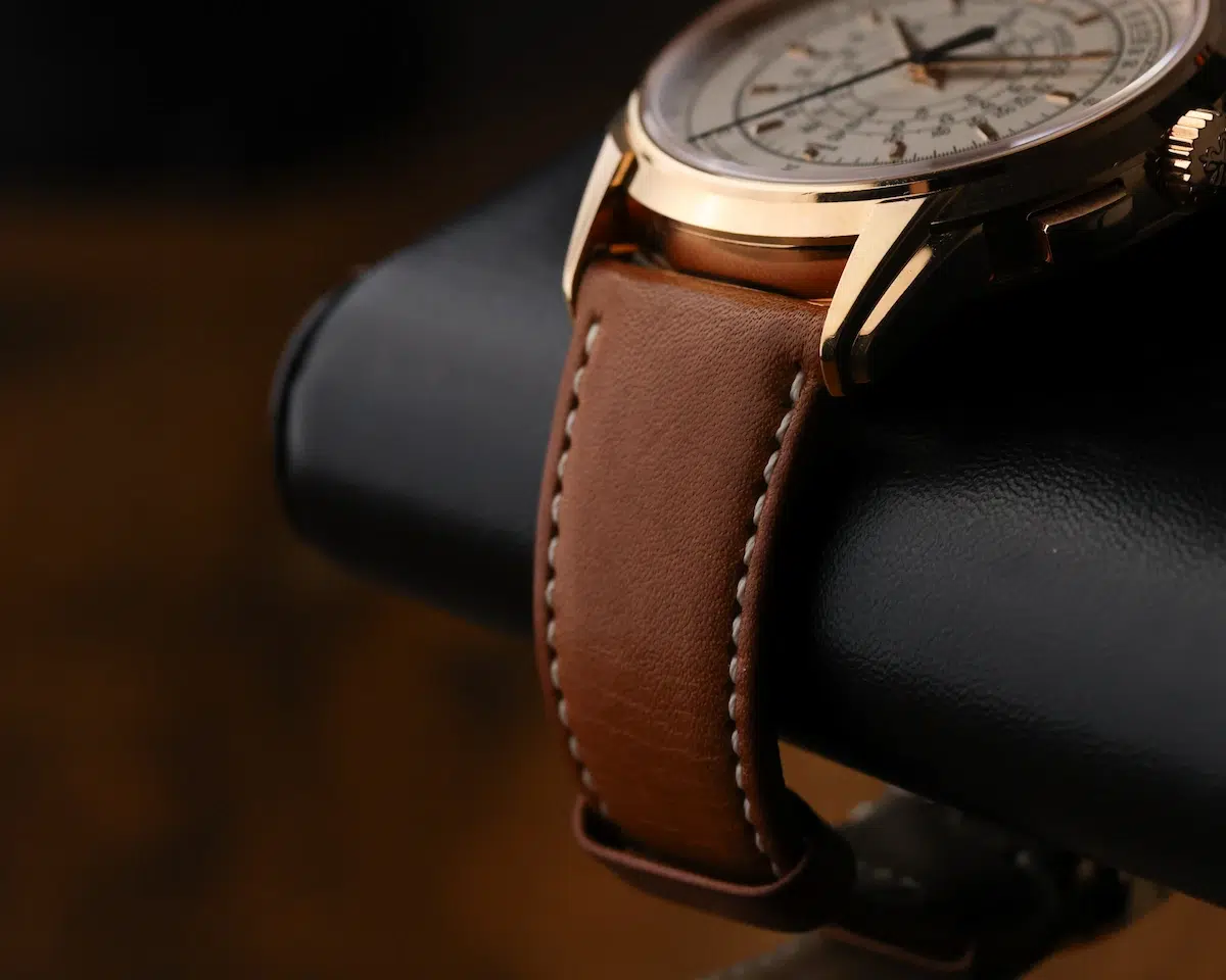 Side profile of Patek Philippe 5975R-001 rose-gold case and brown leather strap