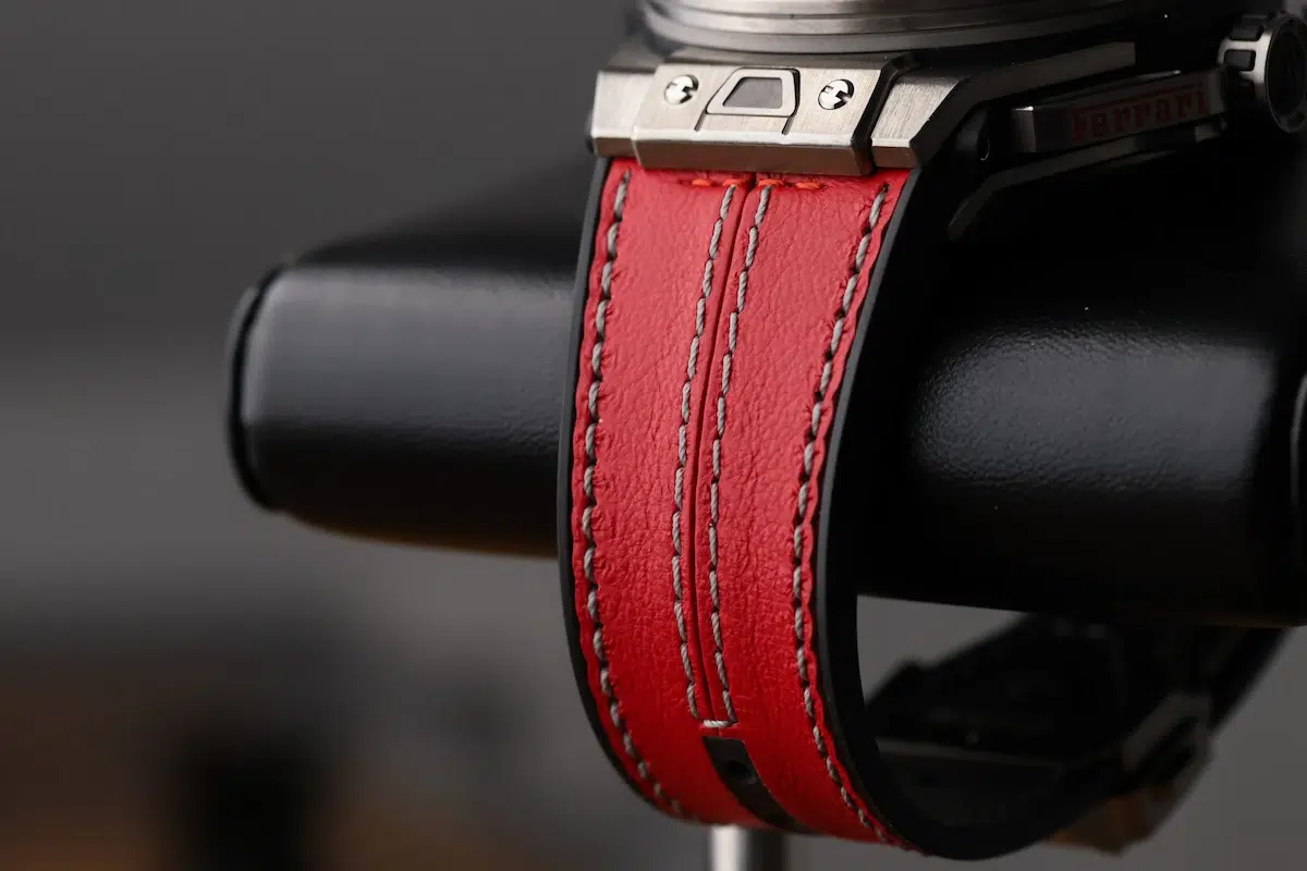 Side view of red and black Hublot rubber strap attached to the case
