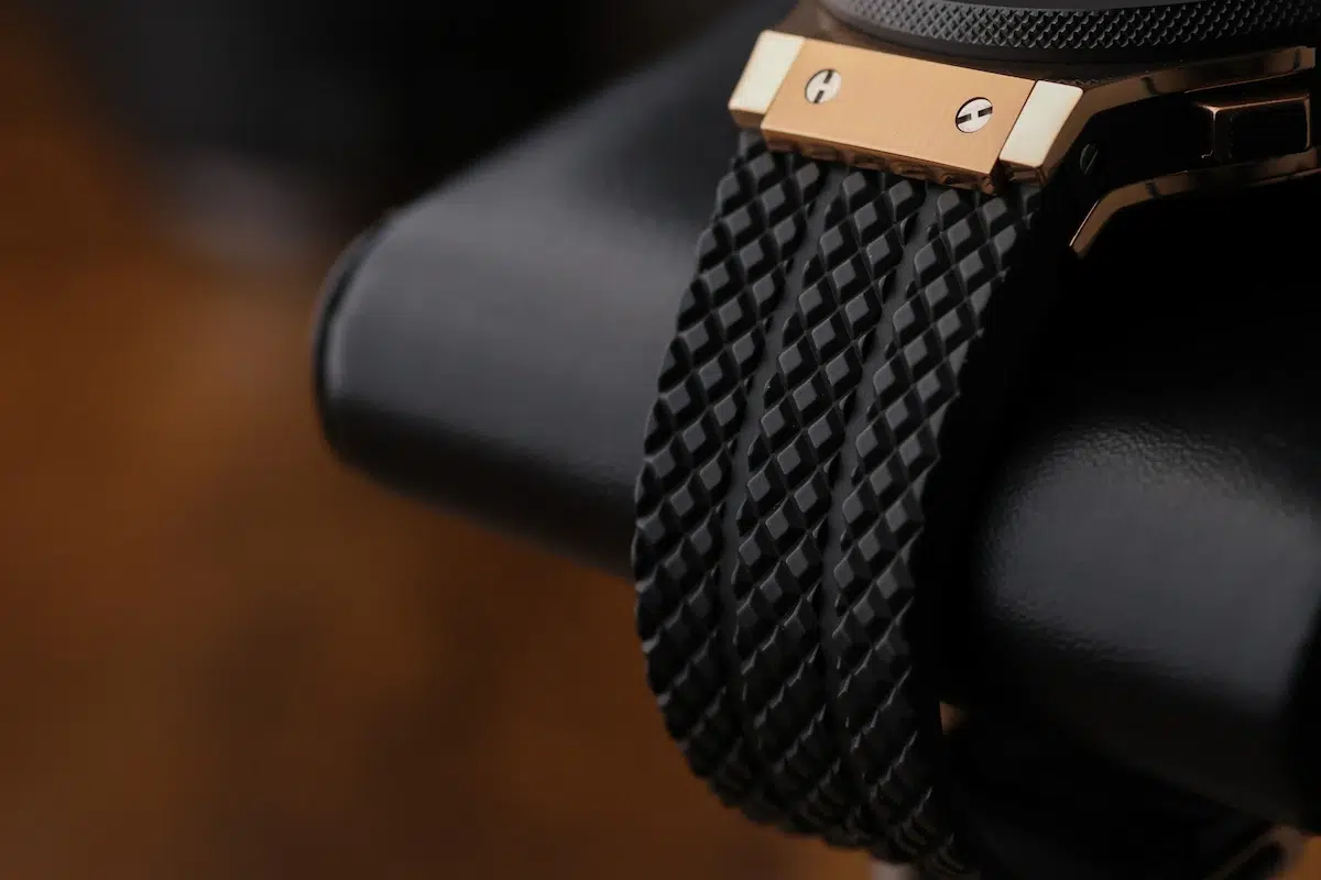 Textured black rubber strap on the Hublot Big Bang Chronograph, shown from the side to highlight the pattern and finish