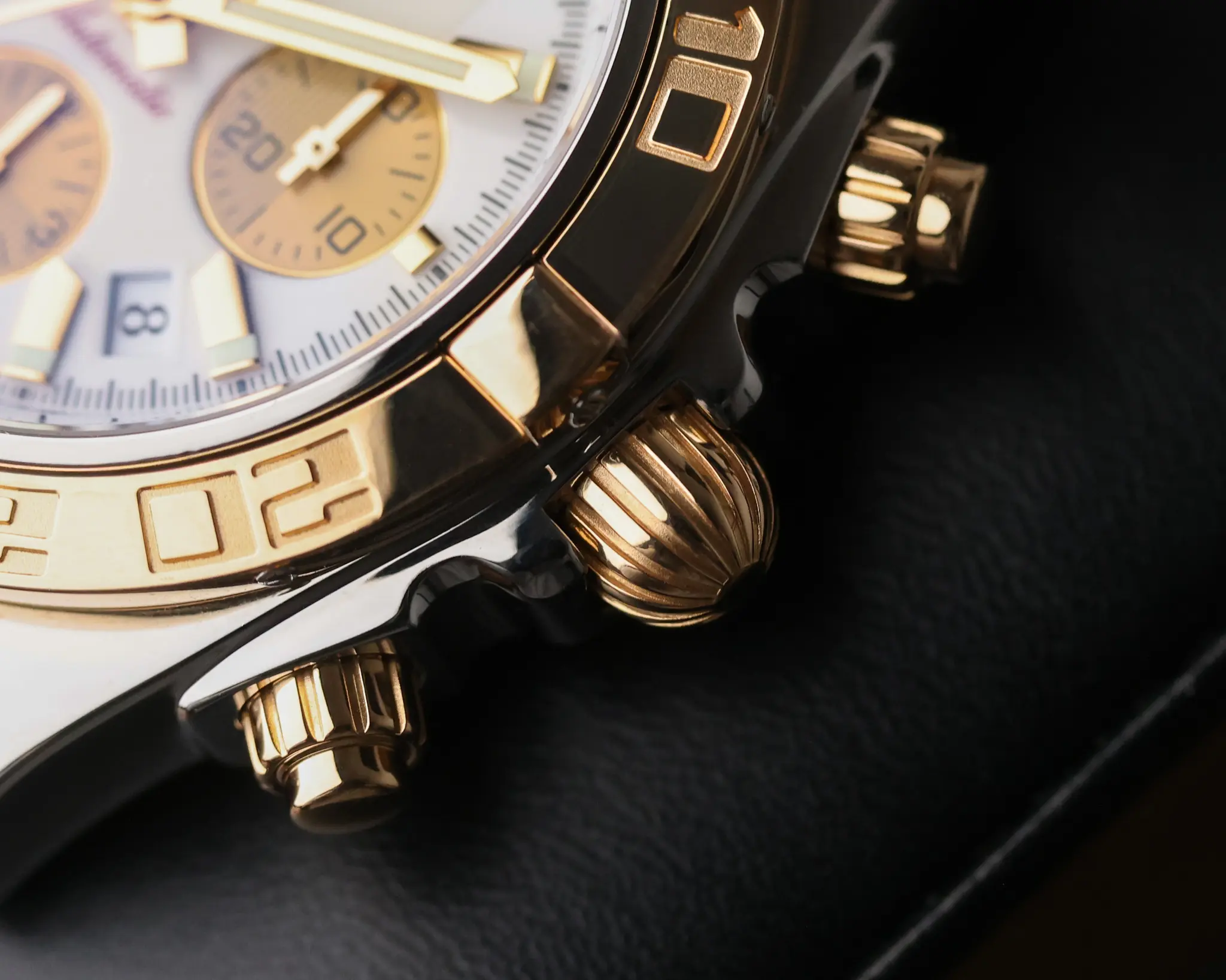 Breitling Chronomat 44mm CB011012A696 crown and chronograph pushers in rose gold and steel