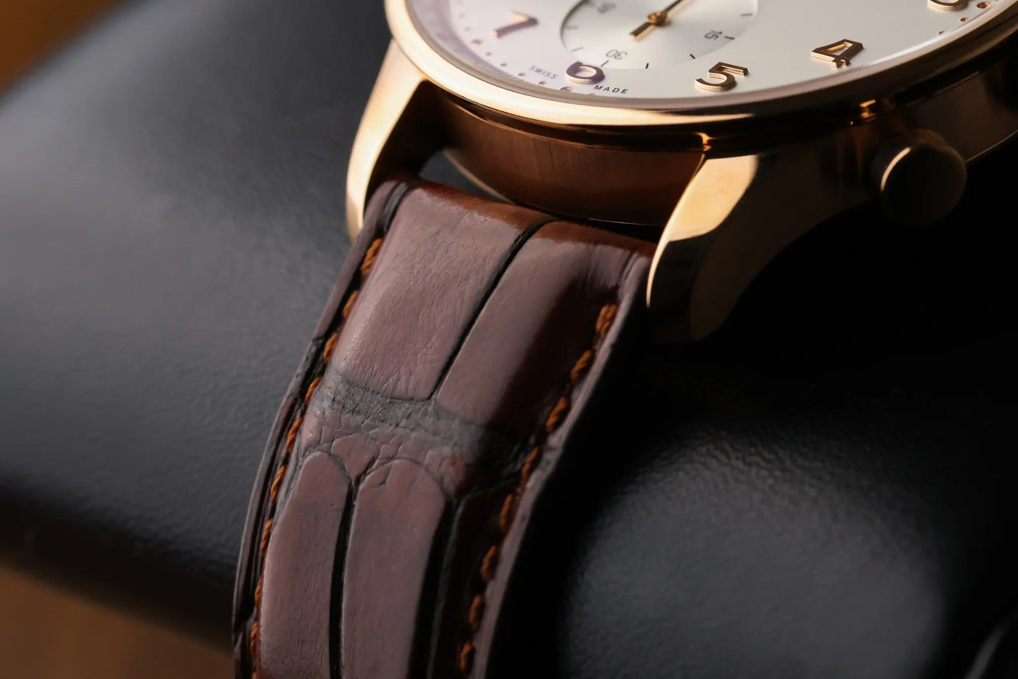 Brown alligator leather strap attached to IWC Portugieser Chronograph rose gold case