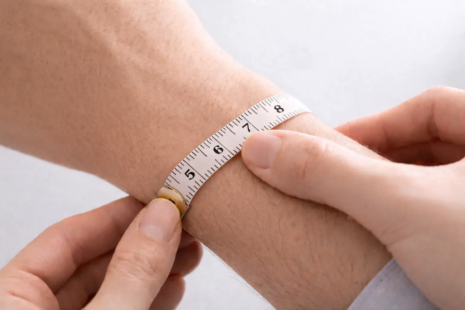 Measuring a wrist with tape