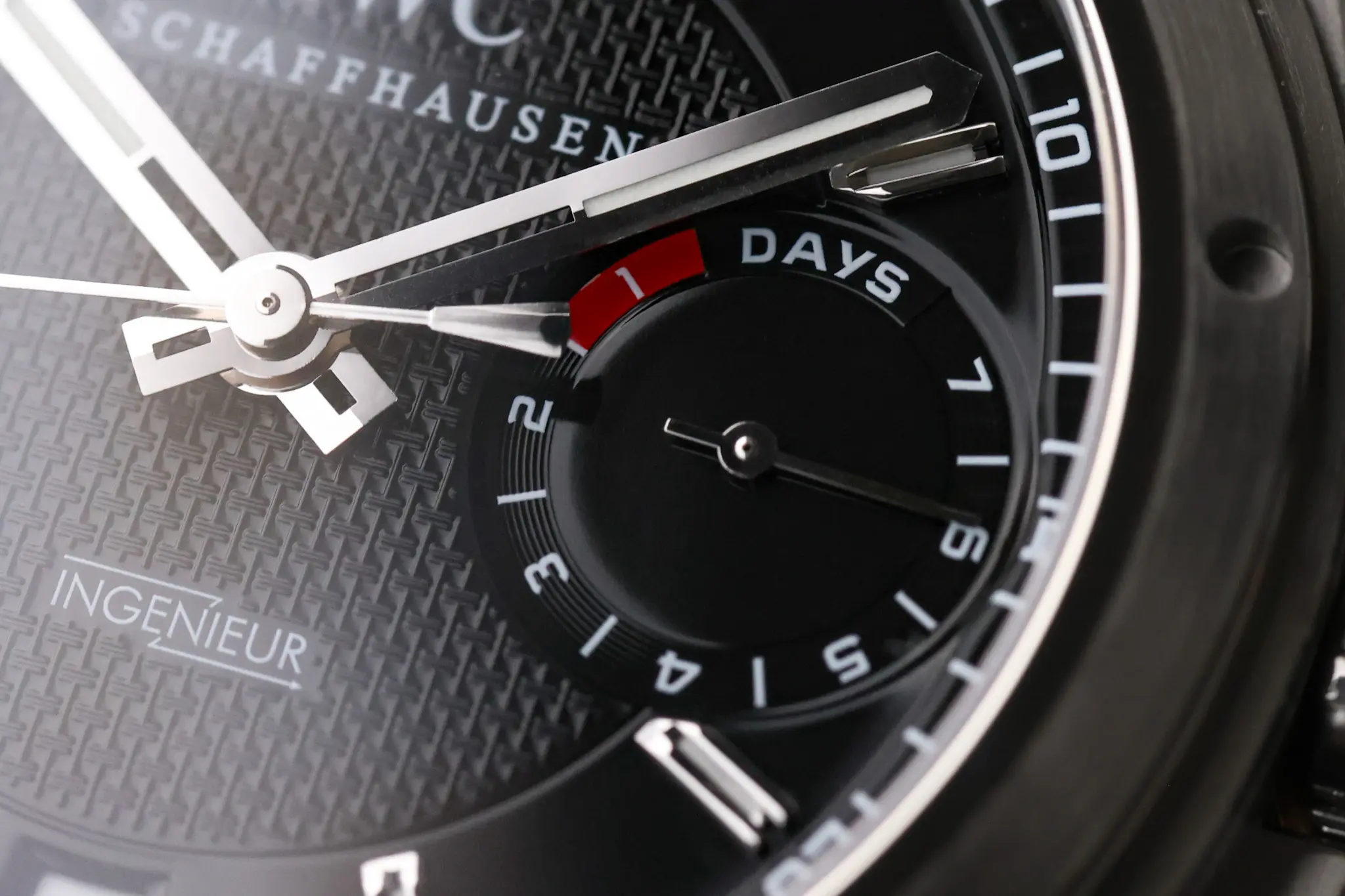 Close-up of IWC Big Ingenieur dial showing power reserve indicator and textured black surface