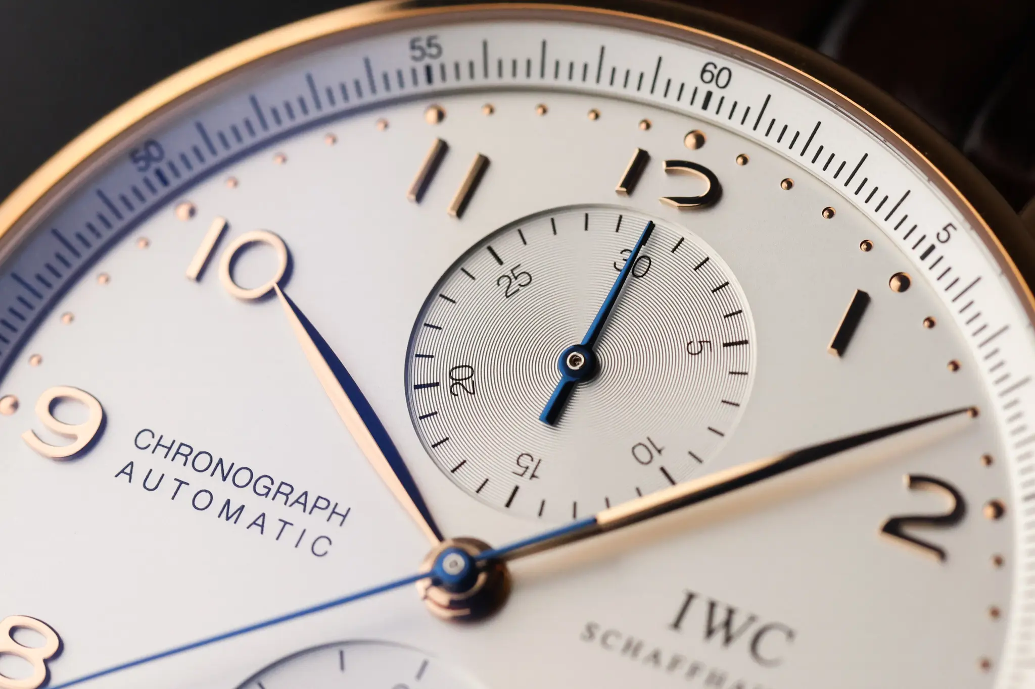 Close-up of IWC Portugieser Chronograph white dial with blue hands and subdials