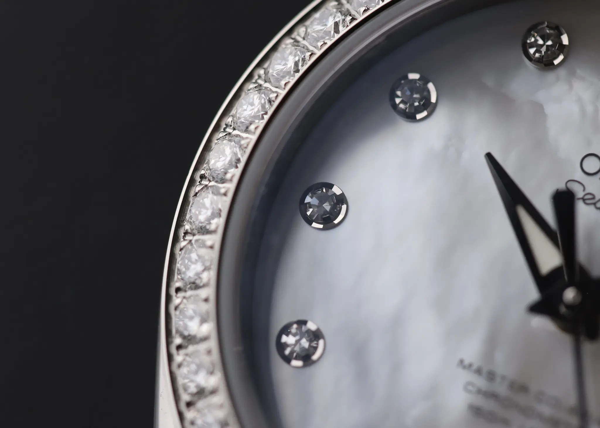 Close-up of diamond-set bezel and white dial on Omega Seamaster Aqua Terra 150M