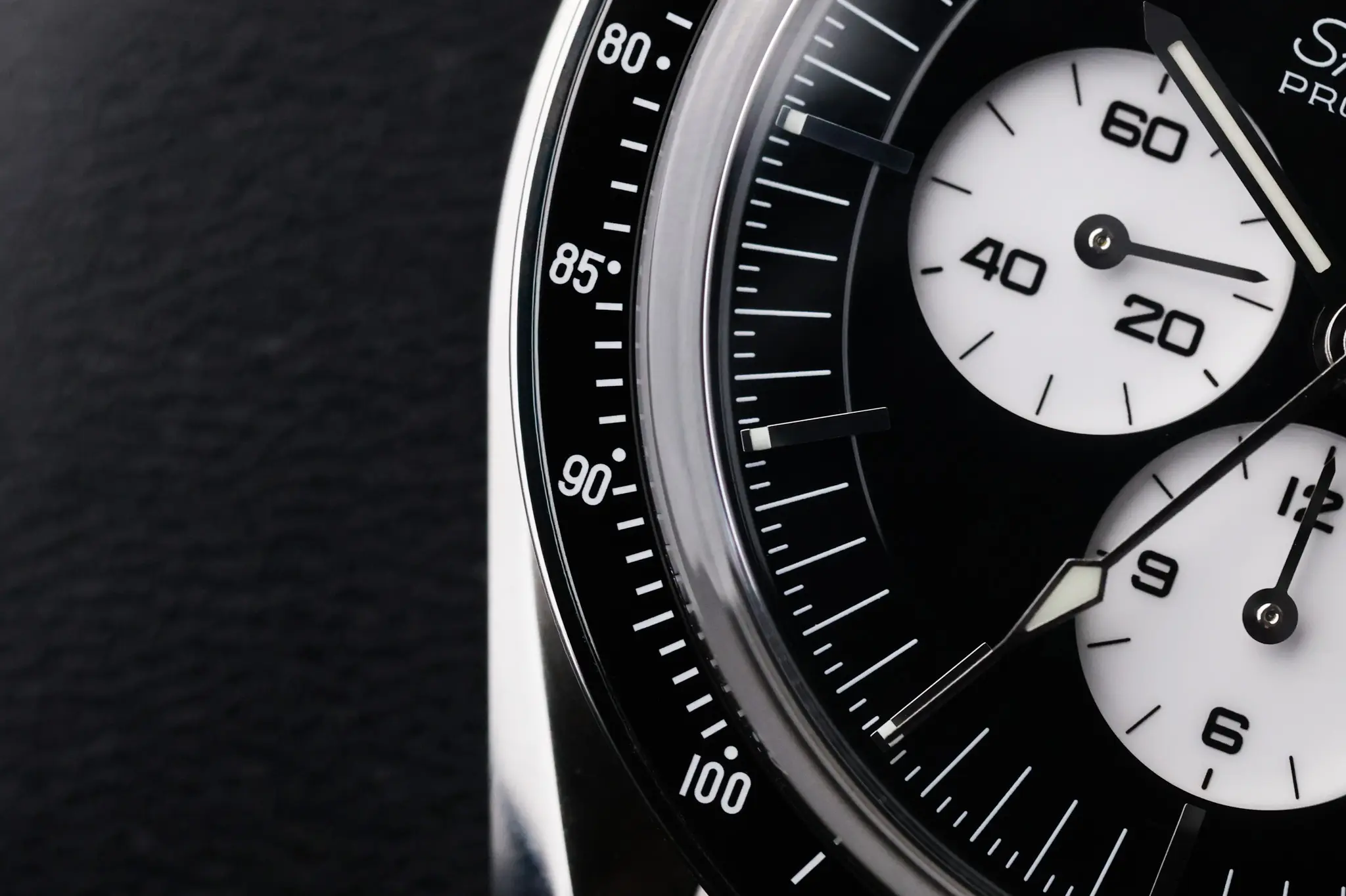 Detailed view of Omega Speedmaster Moonwatch tachymeter scale and chronograph subdial