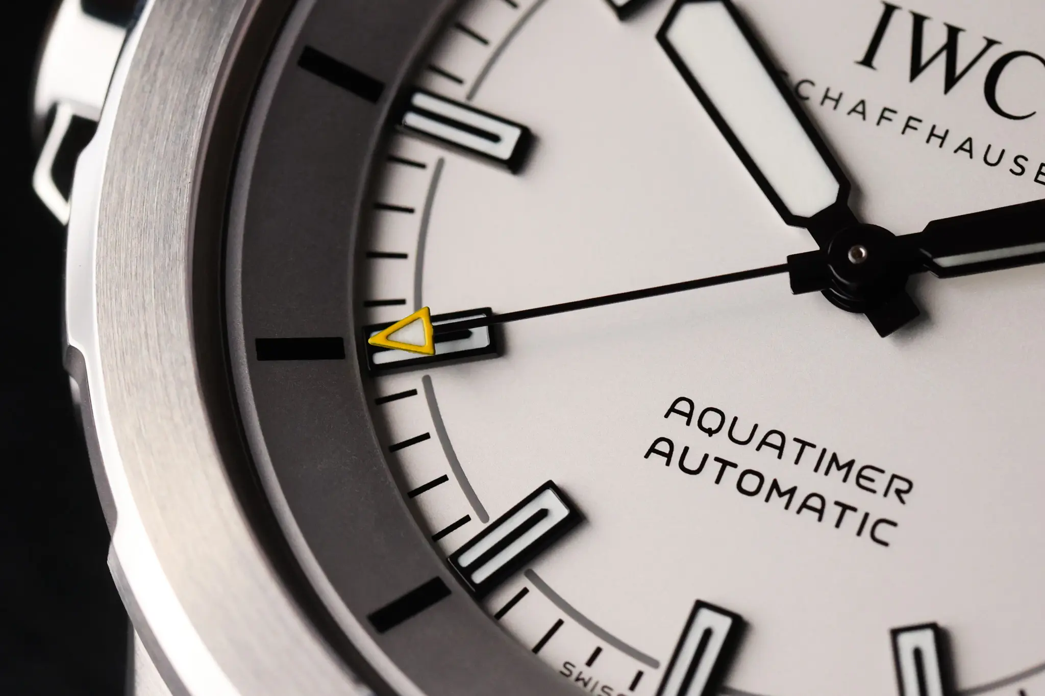 Detailed view of the IWC Aquatimer dial with sword hands and luminous hour markers