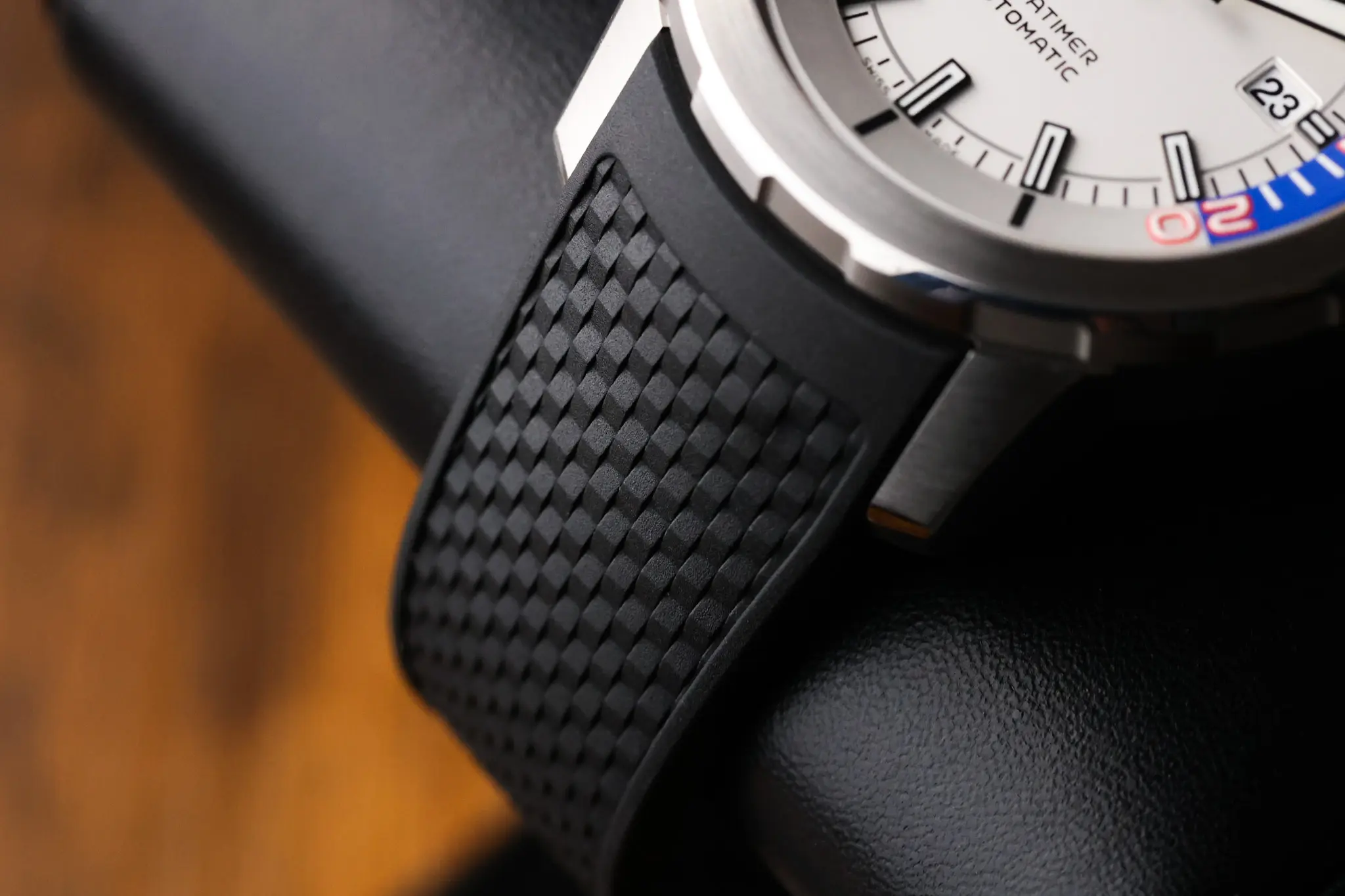 IWC Aquatimer black rubber strap with textured finish attached to the case