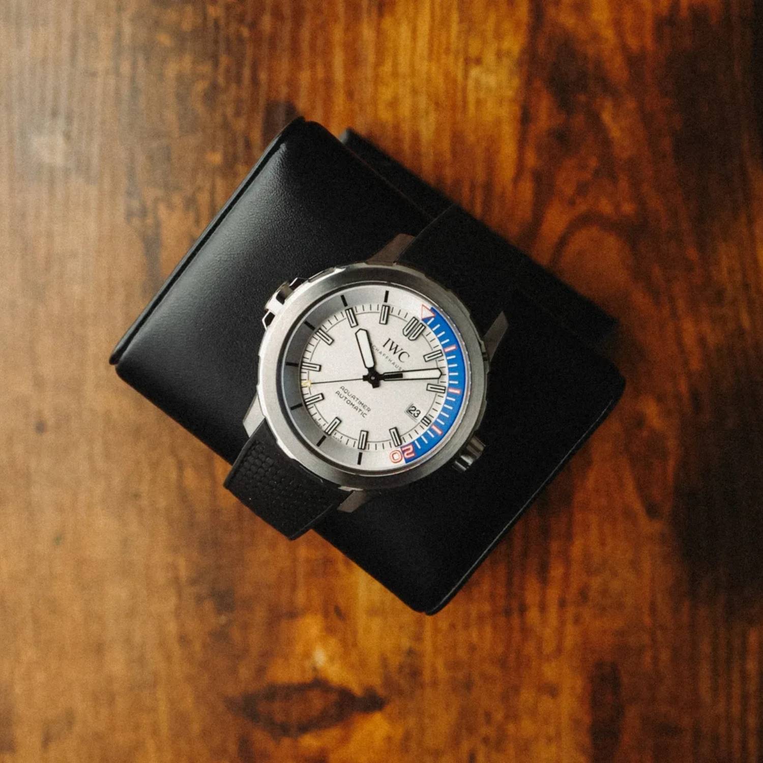IWC Aquatimer ZSC Lions IW3290-07 dive watch photographed from above on a wooden surface