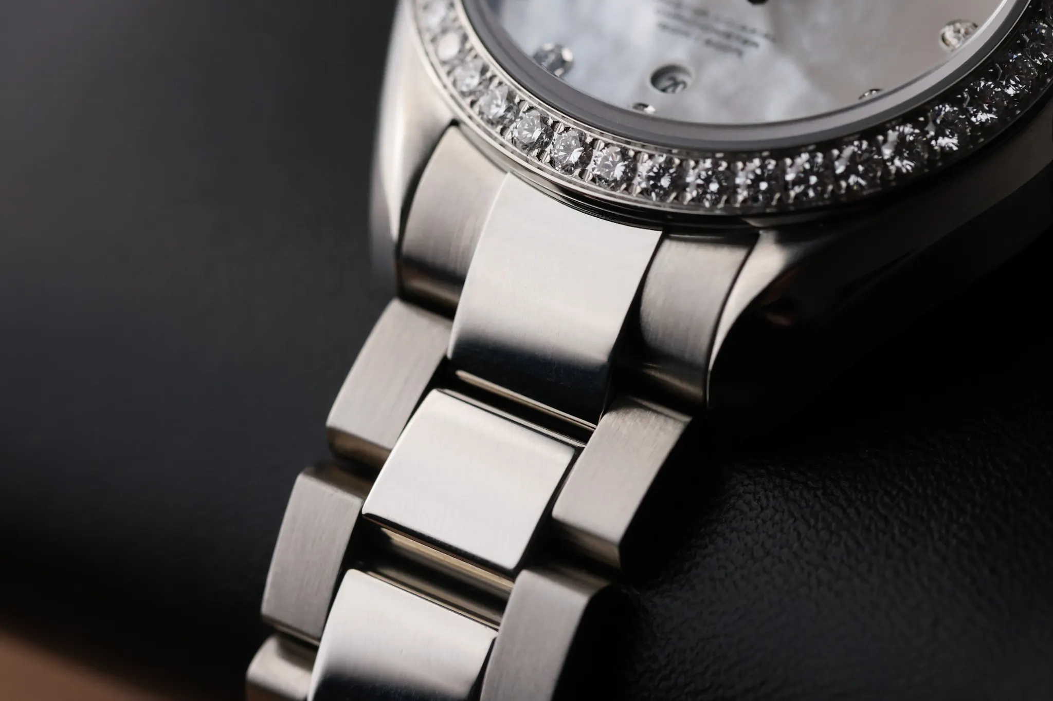 Stainless steel bracelet and case detail of Omega Seamaster Aqua Terra 150M with diamond bezel