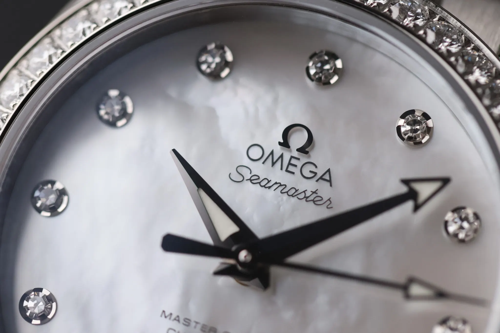 White dial Omega Seamaster Aqua Terra 150M with diamond hour markers and Omega logo