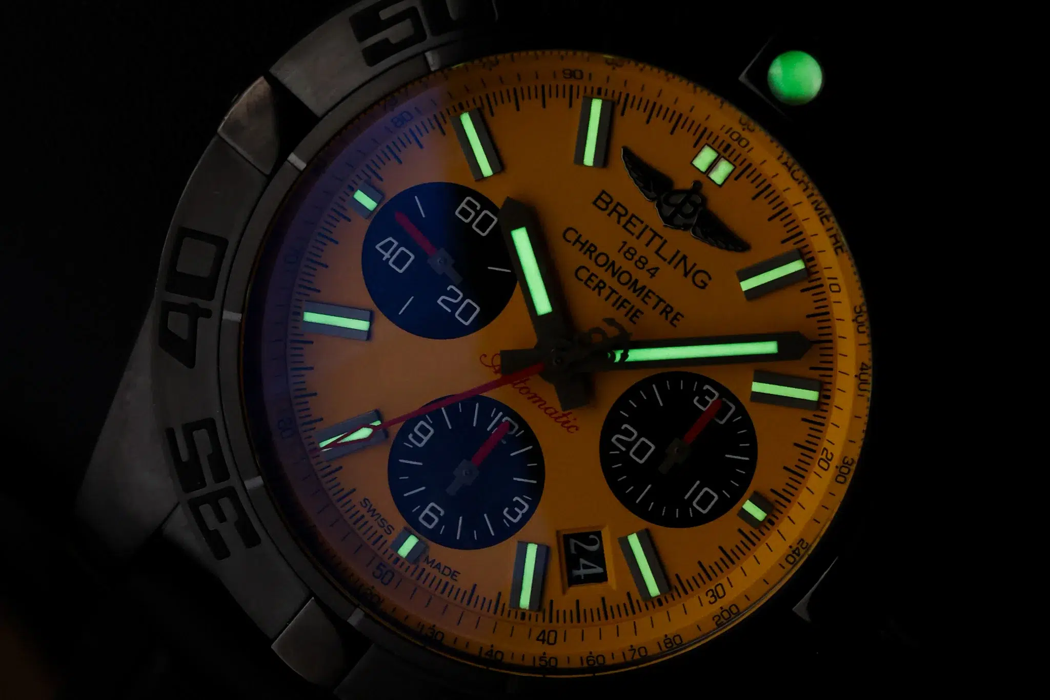 Breitling Chronomat Blacksteel dial with luminous hands in low-light conditions