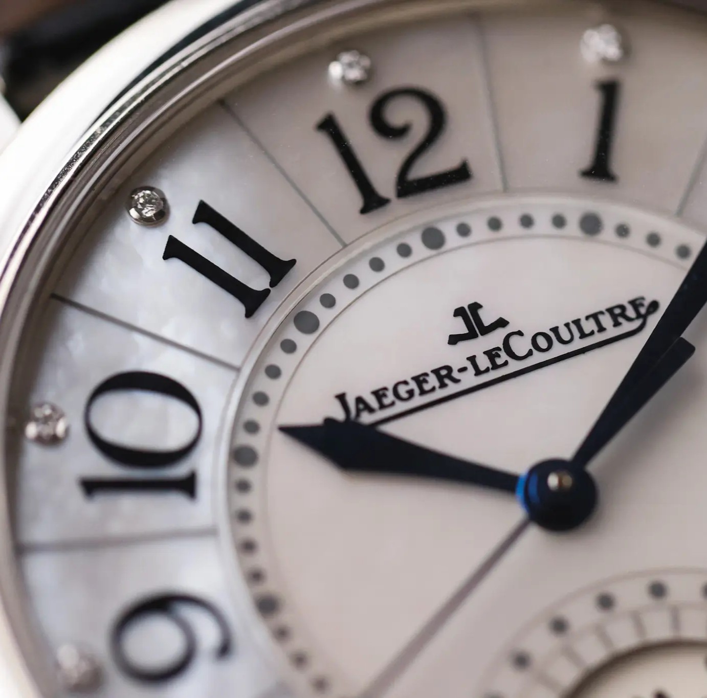 Close-up of Jaeger-LeCoultre Rendez-Vous Date dial Arabic numerals and blued hands
