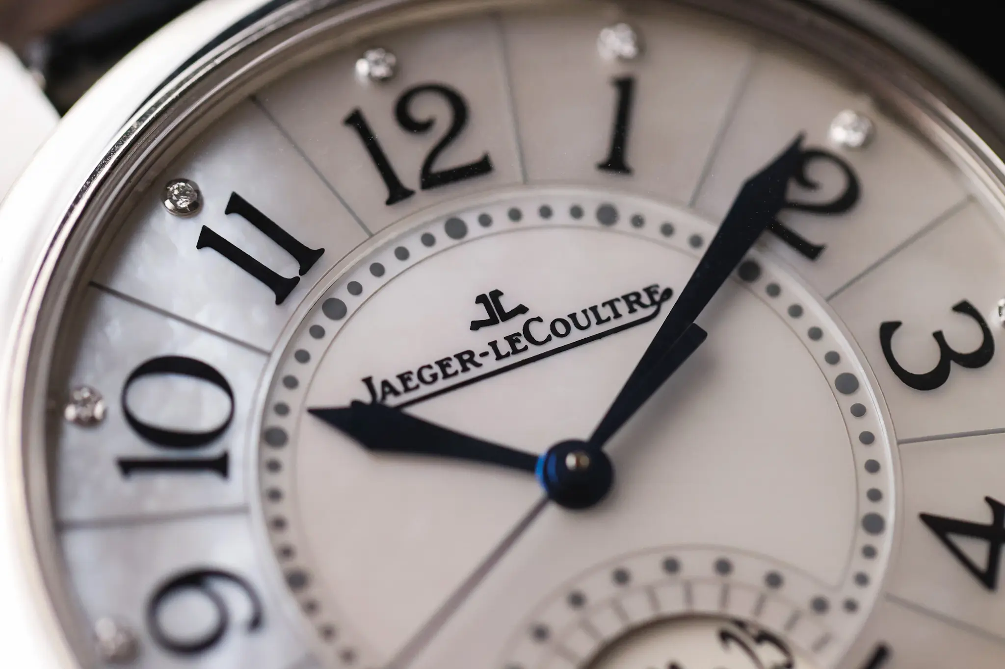 Close-up of Jaeger-LeCoultre Rendez-Vous Date dial with Arabic numerals and blued hands