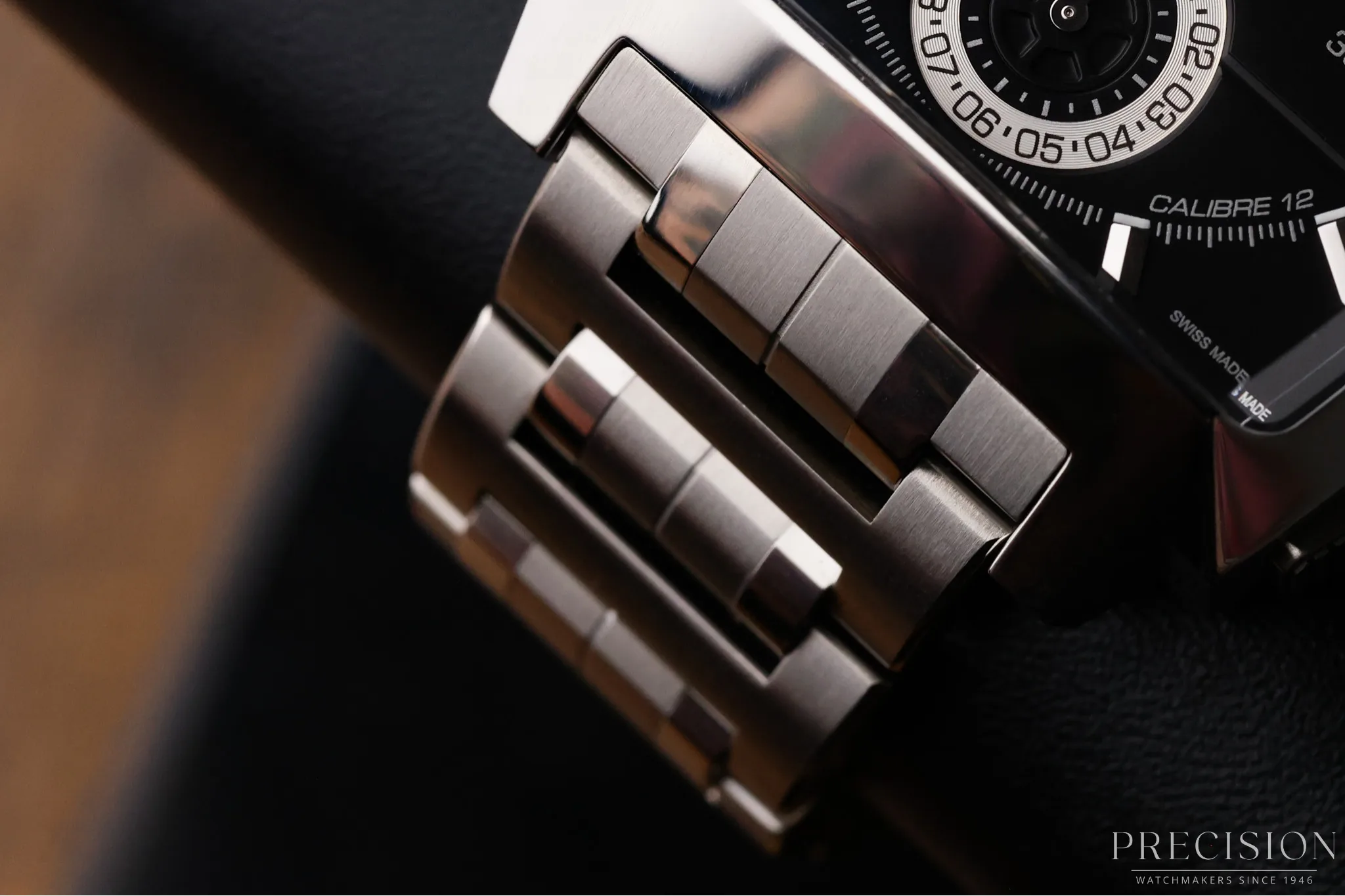 Close-up of TAG Heuer Monaco LS stainless steel bracelet links with polished and brushed finishing