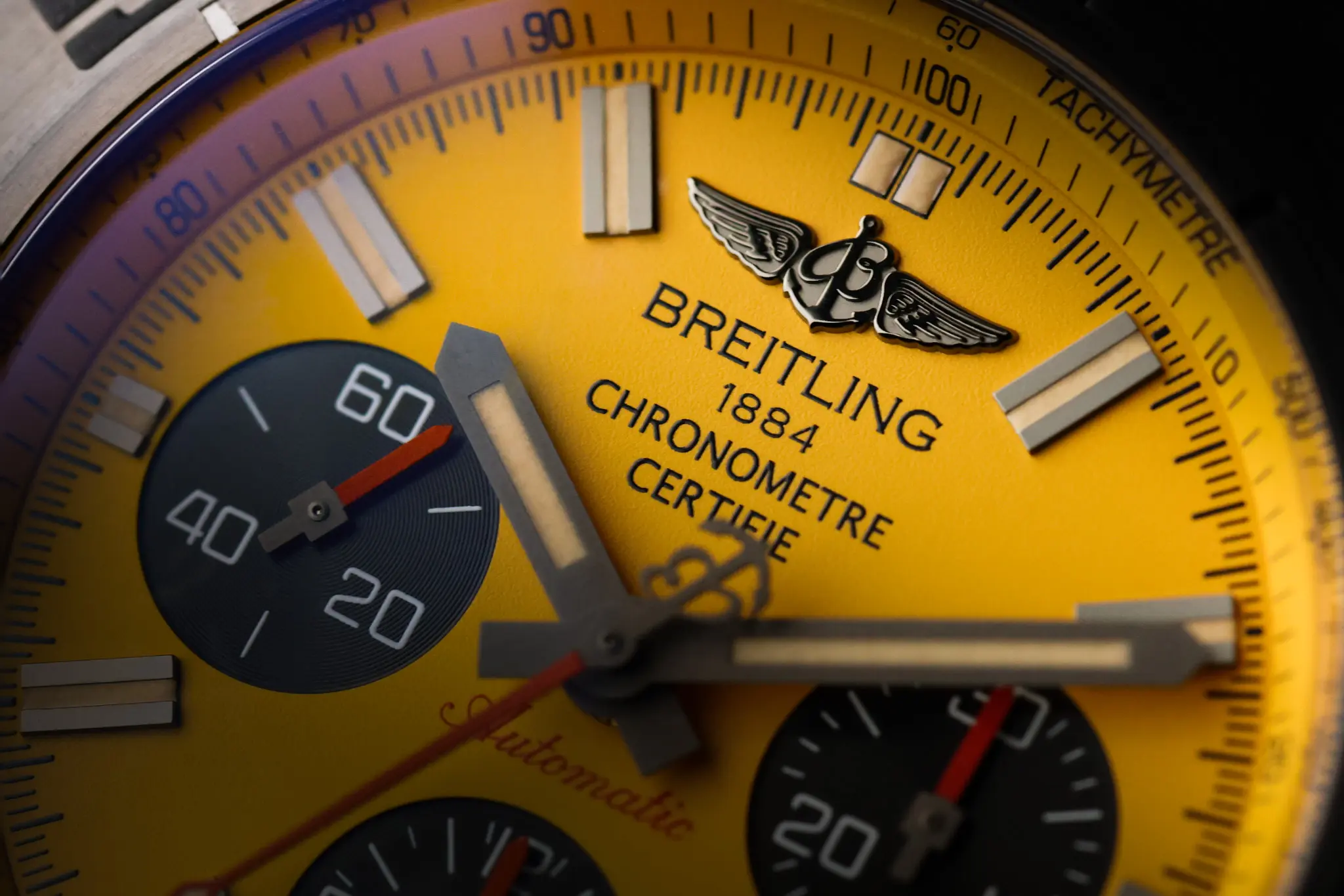 Close-up of the yellow dial on the Breitling Chronomat Blacksteel chronograph