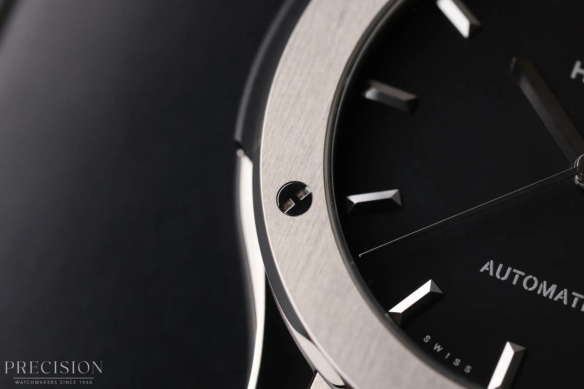 Detailed macro of Hublot Classic Fusion matte black dial and applied hour indices