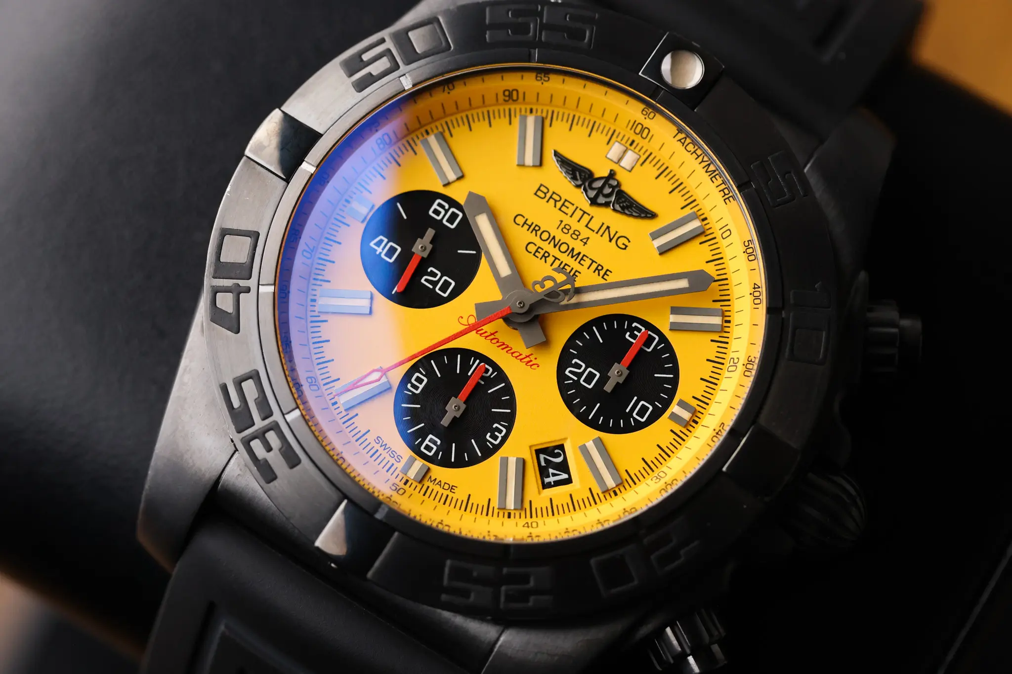 Front view of Breitling Chronomat Chronograph 44 Blacksteel with yellow dial