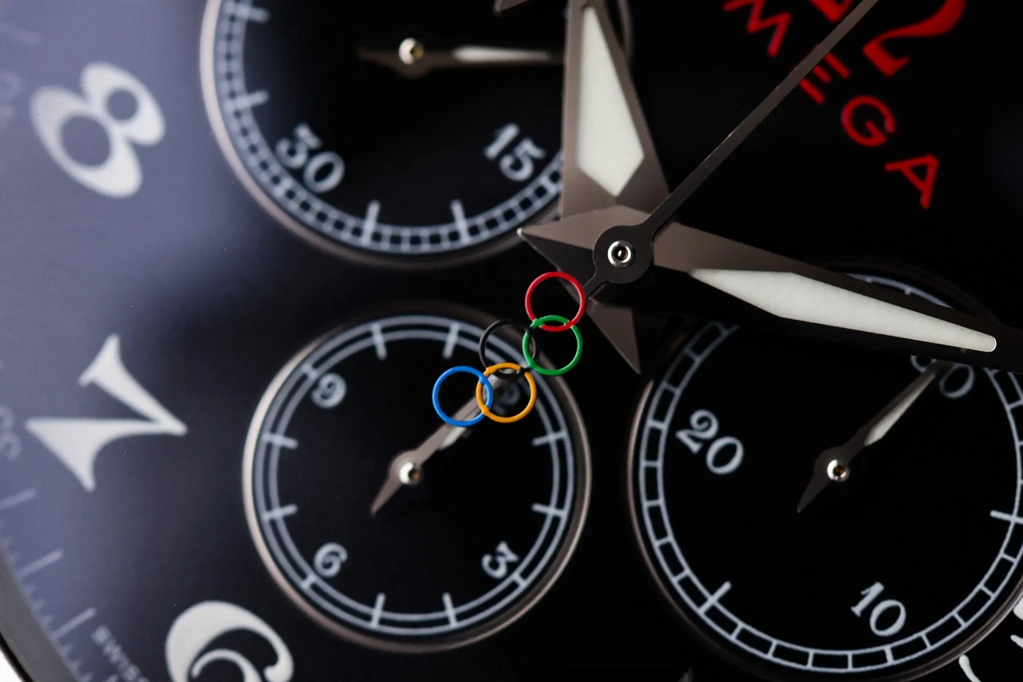 Macro view of Omega Planet Ocean chronograph subdials with Olympic ring counterweight detail