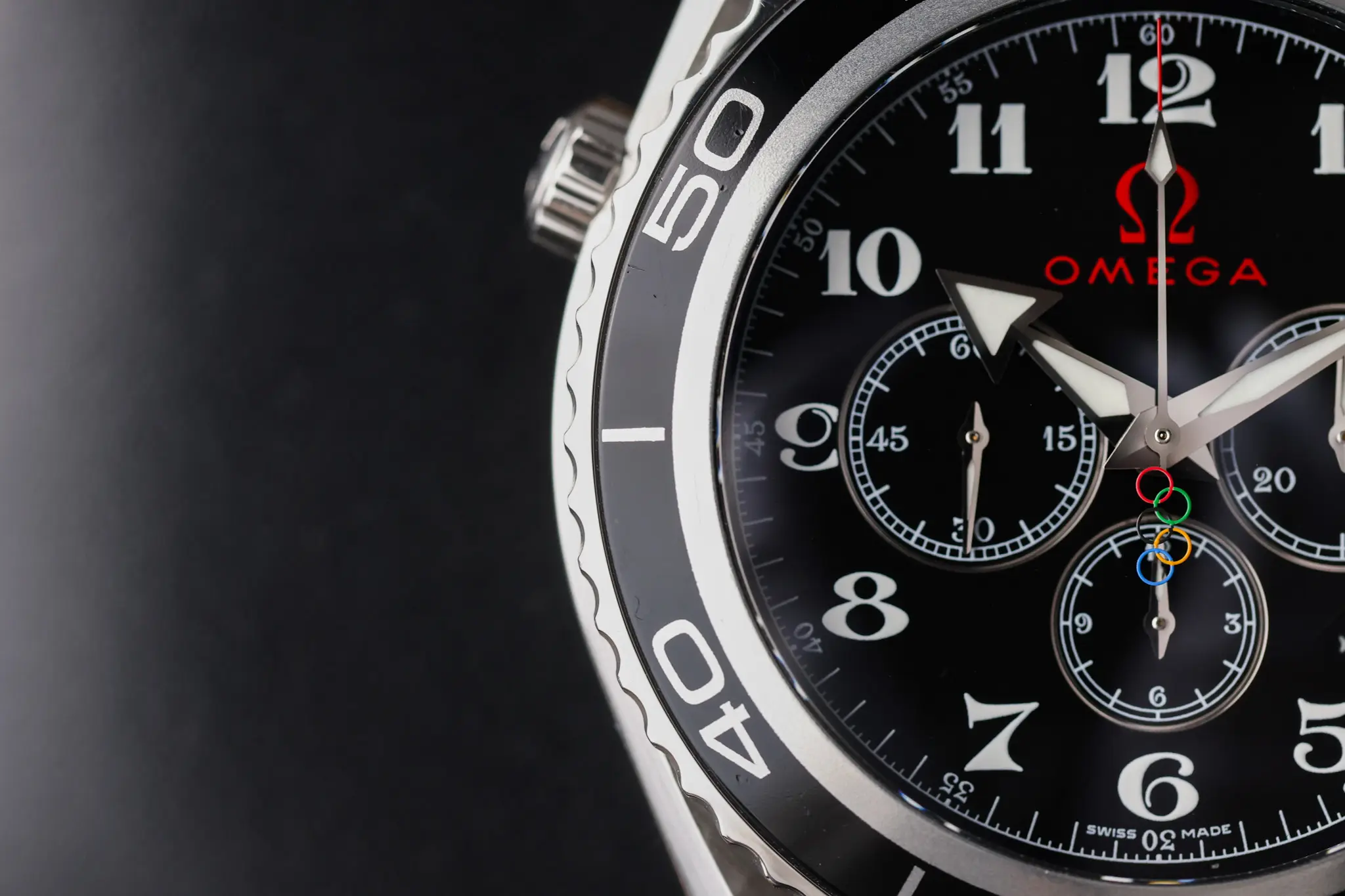 Omega Seamaster Planet Ocean Olympic chronograph bezel and dial close-up with 600m marking