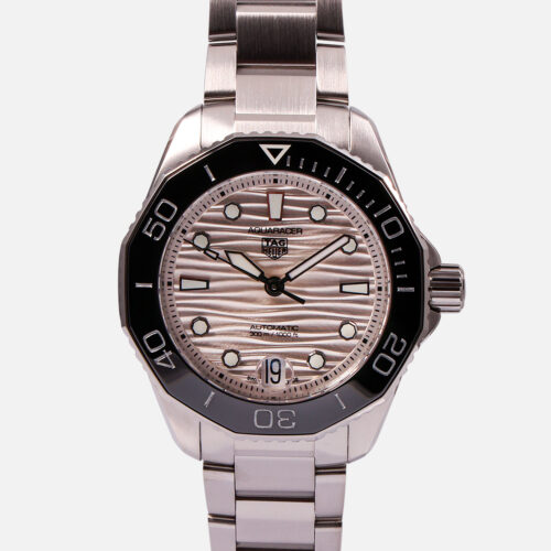 Front view of a pre-owned TAG Heuer Aquaracer Professional 300 36mm (Ref. WBP231C.BA0626) featuring a silver wavy dial, black ceramic bezel, and stainless steel bracelet.