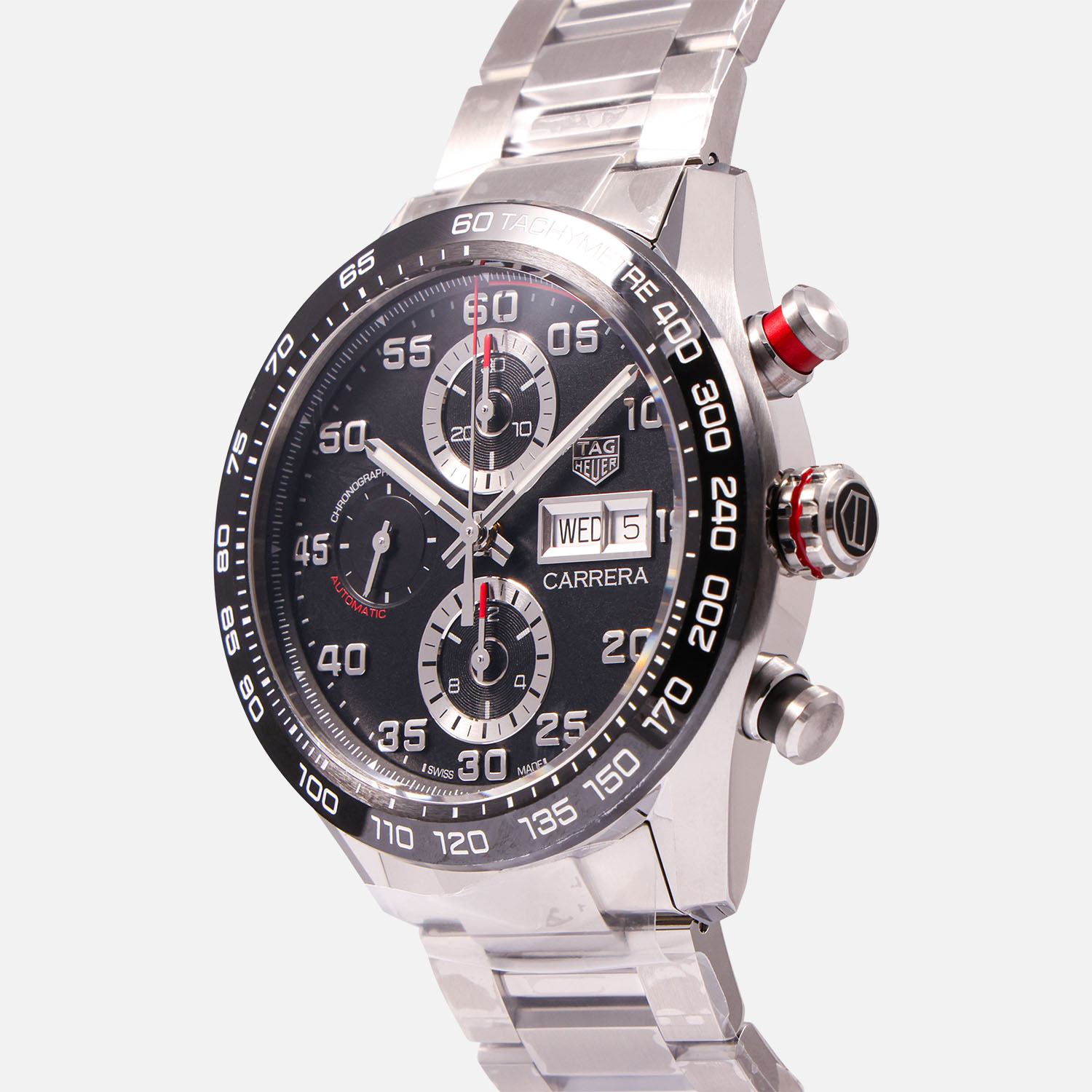 Crown side view of a pre-owned TAG Heuer Carrera Chronograph 44mm (Ref. CBN2A1AABA0643) in stainless steel featuring a black dial with triple chronograph registers, day-date window, and a steel bracelet.