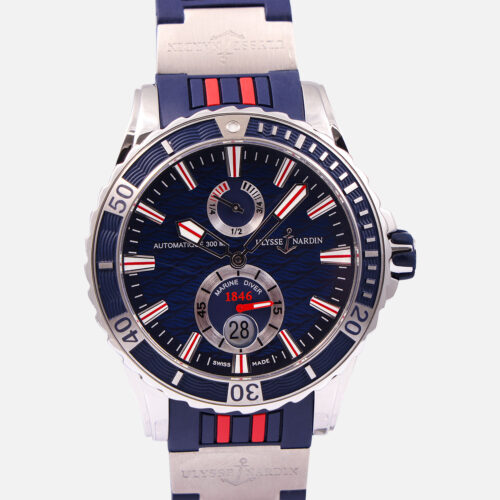 Front view of a pre-owned Ulysse Nardin Maxi Marine Diver 44mm (Ref. 263-10) in stainless steel featuring a blue dial with a wave motif, a power reserve indicator at 12 o'clock, small seconds at 6 o'clock, and a blue and red rubber strap.