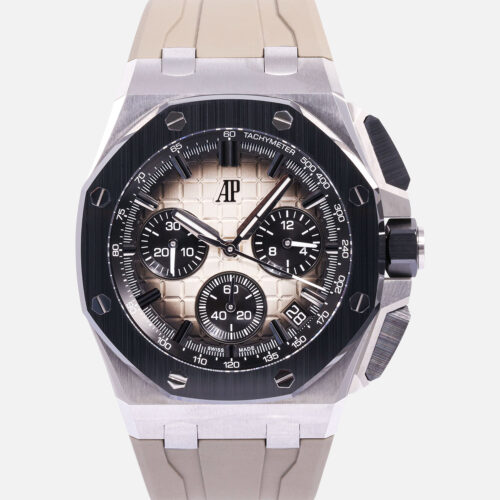 Front view of a pre-owned Audemars Piguet Royal Oak Offshore Chronograph 43mm (Ref. 26420SO.OO.A600CA.01) showcasing its stainless steel octagonal case, black ceramic bezel with exposed hex screws, smoked taupe Méga Tapisserie dial with black sub-dials, and an interchangeable taupe rubber strap.