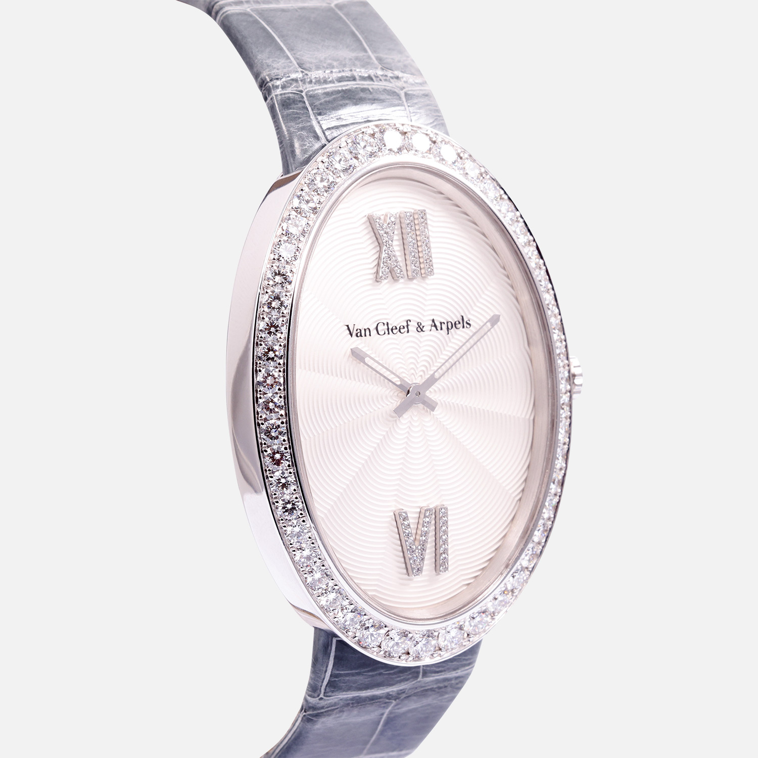 Close-up of Van Cleef & Arpels Timeless XL dial with Roman numeral markers, diamond bezel, and blued hands