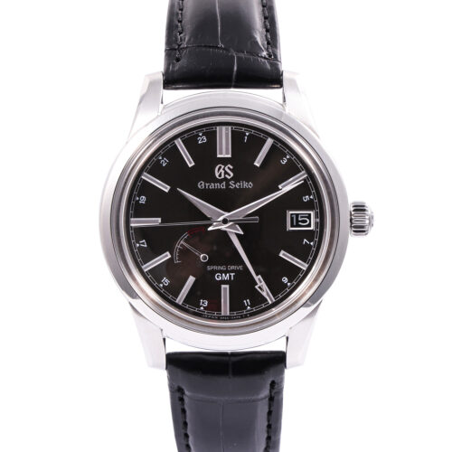 Front view of a pre-owned Grand Seiko Elegance Spring Drive GMT 40.2mm (Ref. SBGE227) in stainless steel, highlighting its dark sunray dial, inner 24-hour GMT ring, power reserve indicator at 8 o'clock, date at 3 o'clock, box-shaped sapphire crystal, and black alligator leather strap.