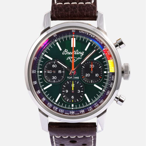 Front view of a pre-owned Breitling Top Time B01 Ford Mustang 41mm (Ref. AB0176) in stainless steel, featuring its green dial, Ford Mustang pony emblem at 12 o'clock, black squircle sub-dials, orange and yellow tachymeter accents, and brown perforated leather racing strap.