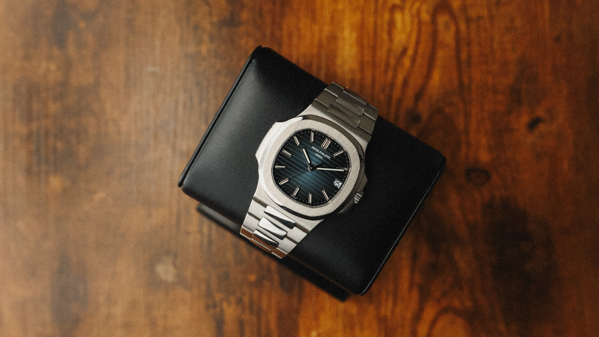 Alt Patek Philippe Nautilus 57111A-010 full watch on display cushion