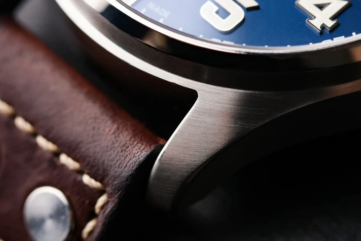 Brushed stainless steel case edge and leather strap stitching on the IWC Big Pilot Le Petit Prince