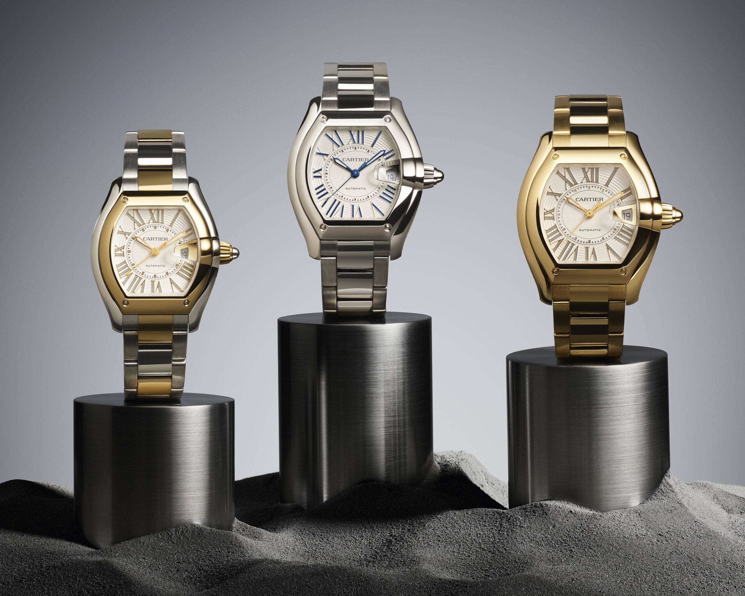 Cartier Roadster in steel, steel and gold, and gold
