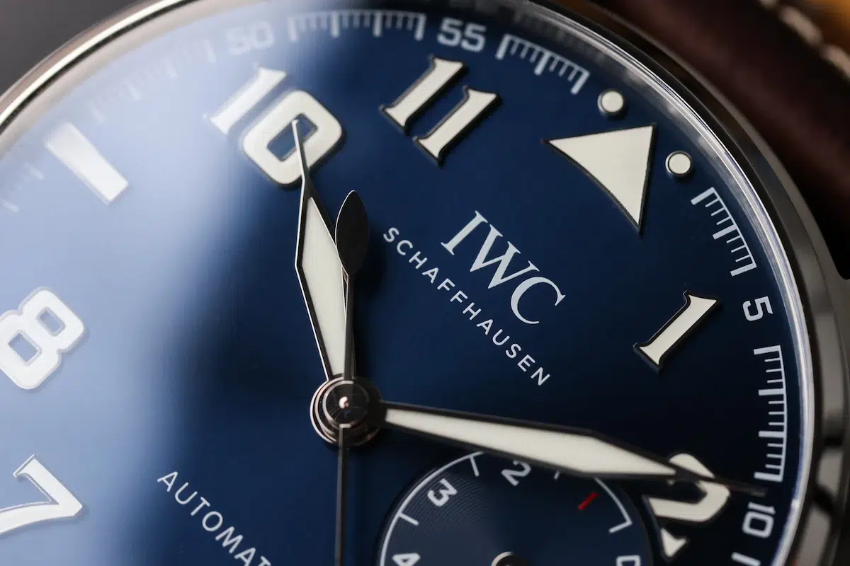 Close-up of the blue sunburst dial on the IWC Big Pilot Le Petit Prince showing Arabic numerals and hands