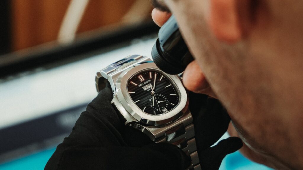 Examining Patek with Loupe