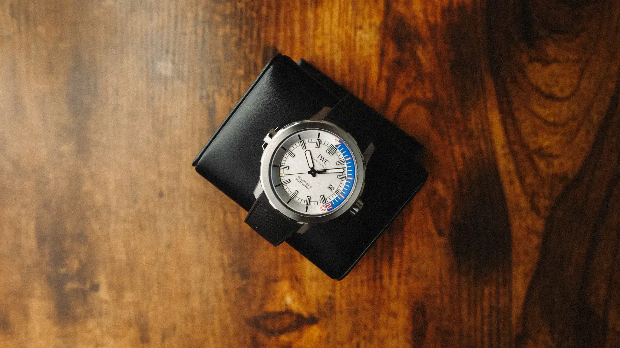 IWC Aquatimer ZSC Lions IW3290-07 dive watch photographed on a wooden surface