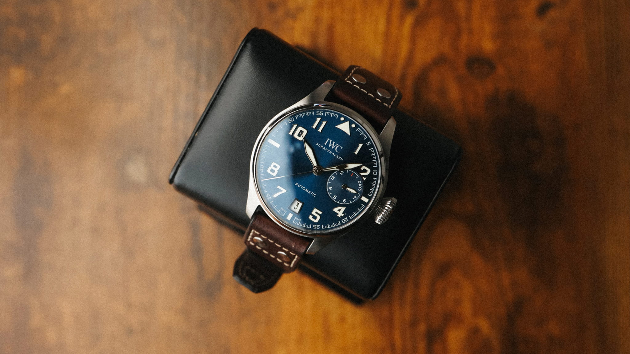 IWC Big Pilot Le Petit Prince IW500908 photographed on leather strap in warm studio lighting