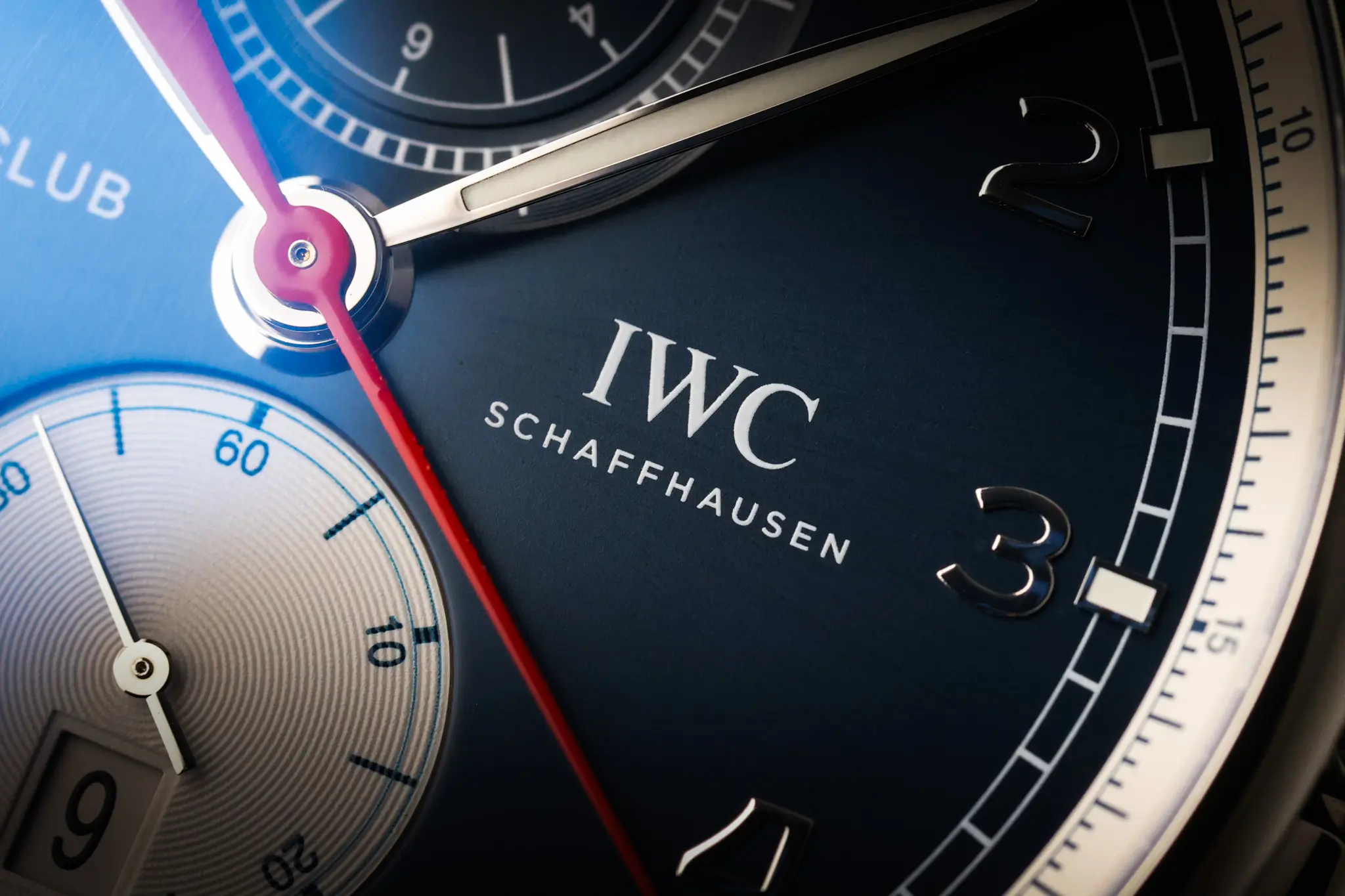 IWC Schaffhausen Portugieser Yacht Club dial detail with white subdials and red chronograph hand